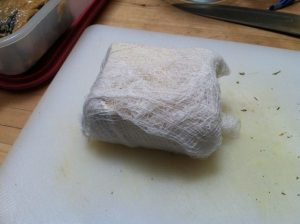 Tofu block wrapped in cheesecloth