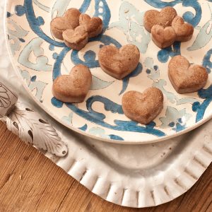 Sweet sun-carob hearts on a blue and white plate