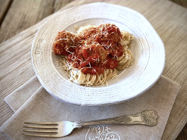 Mama Capra's marinara sauce with meatballs and gluten-free capellini
